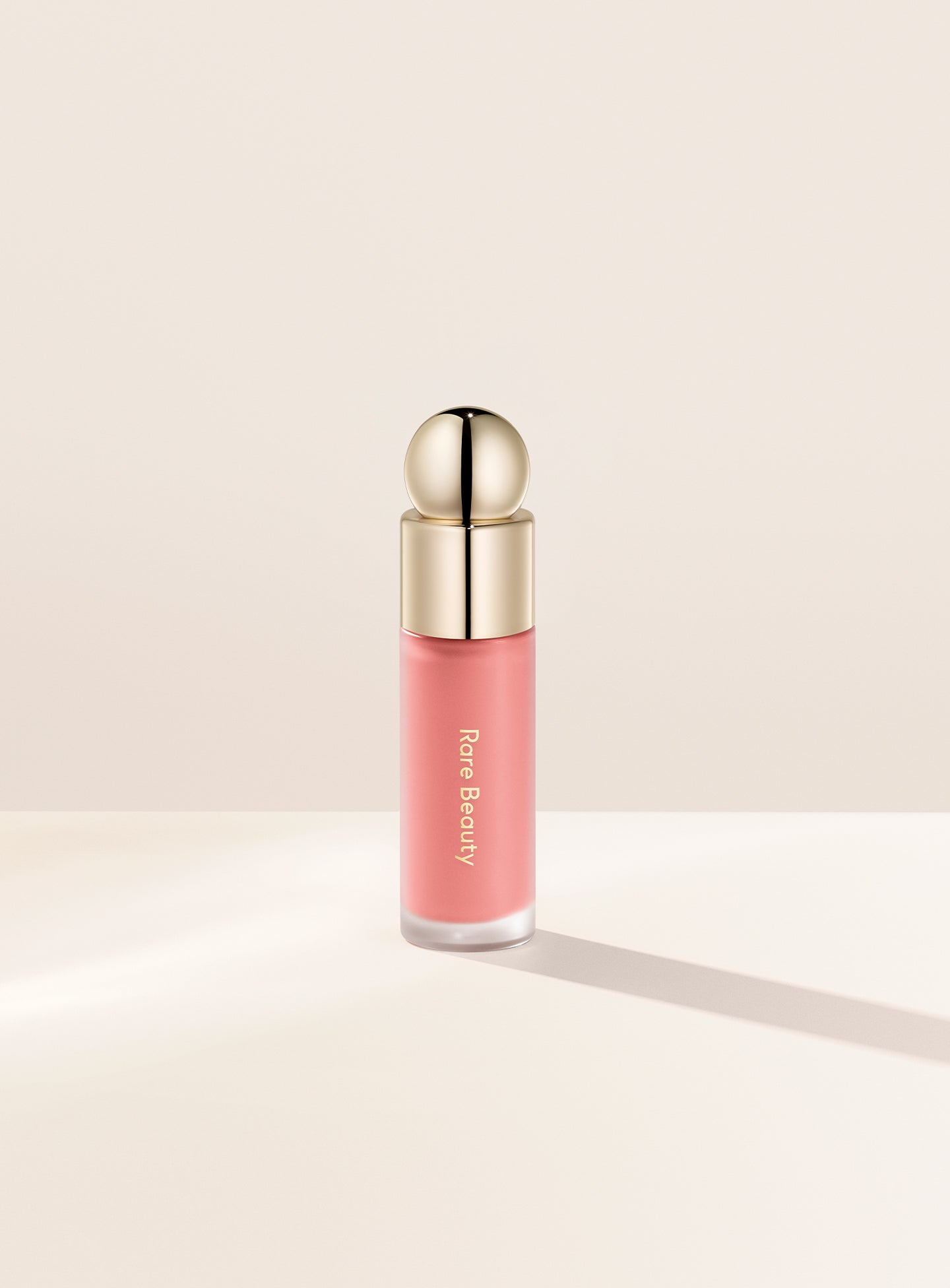 Bliss| Rare Beauty's Soft Pinch Liquid Blush in the matte nude pink shade "Bliss."
